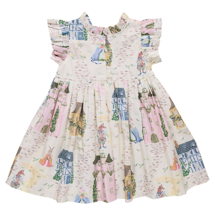 back of Children's dress with a colorful pattern of houses, castle and people on a white background