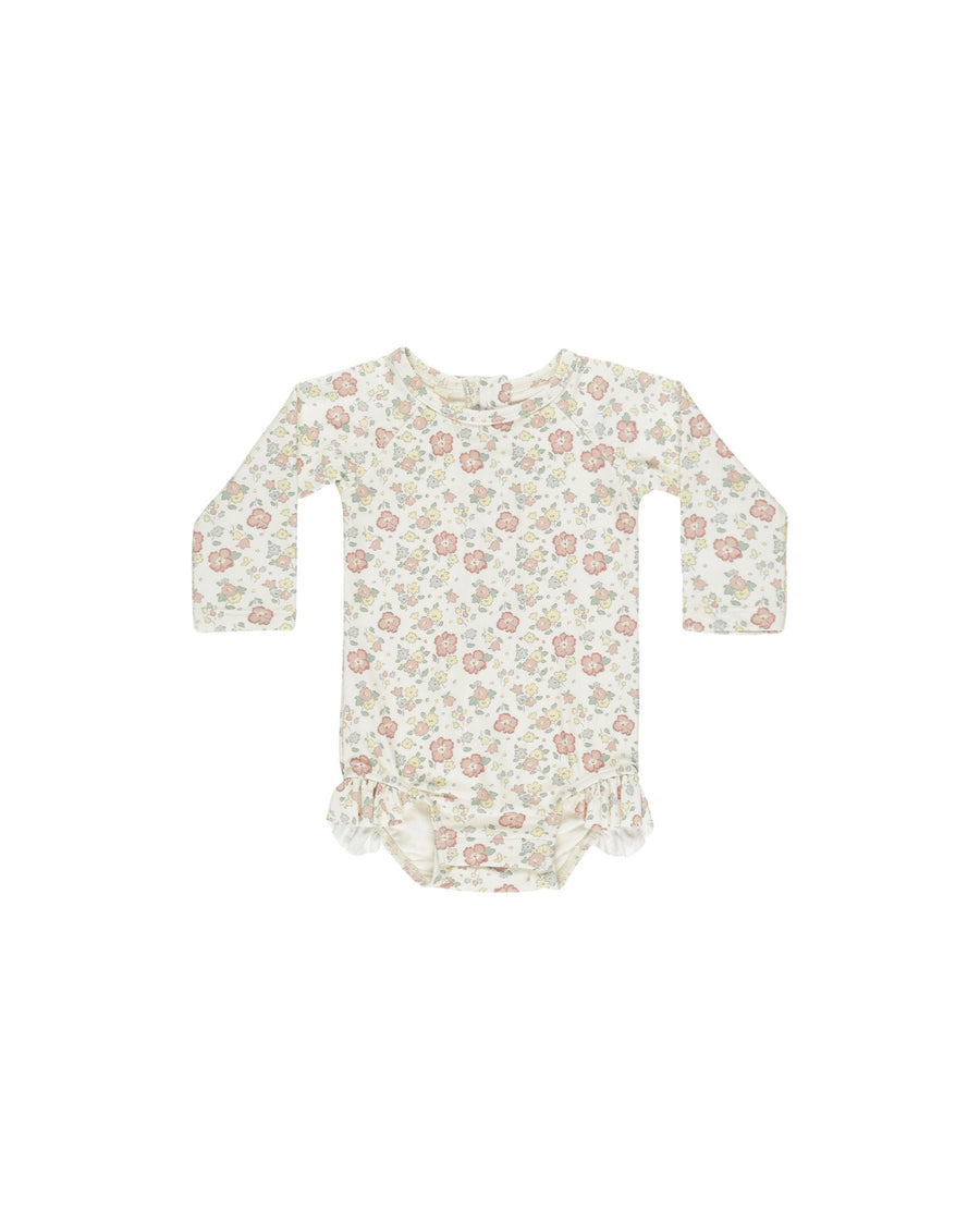 baby girl rashguard bathing suit, long sleeve in pastel floral print. tiny ruffle at the leg opening. 