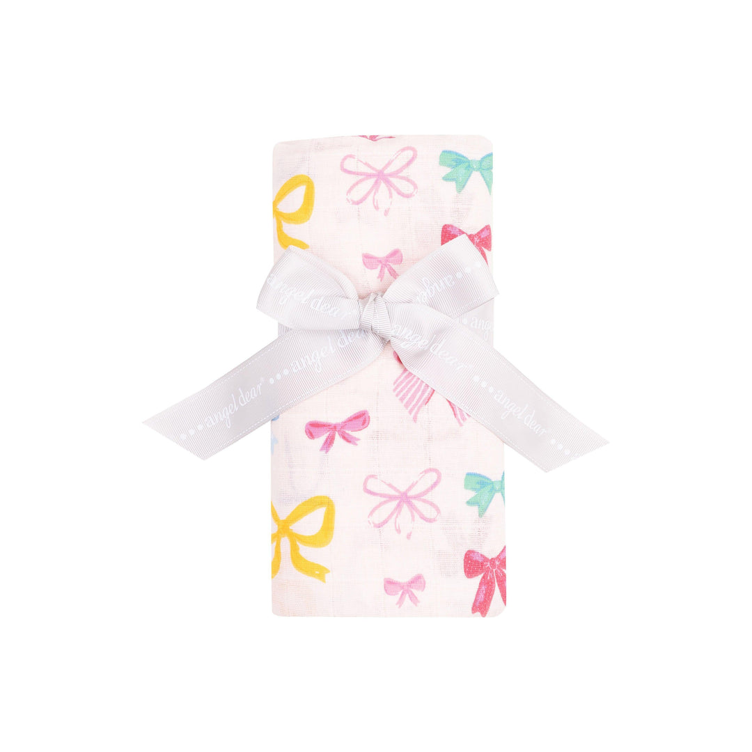 multi colored bow swaddle rolled and tied with a white bow, this is the way the swaddle is sold. 