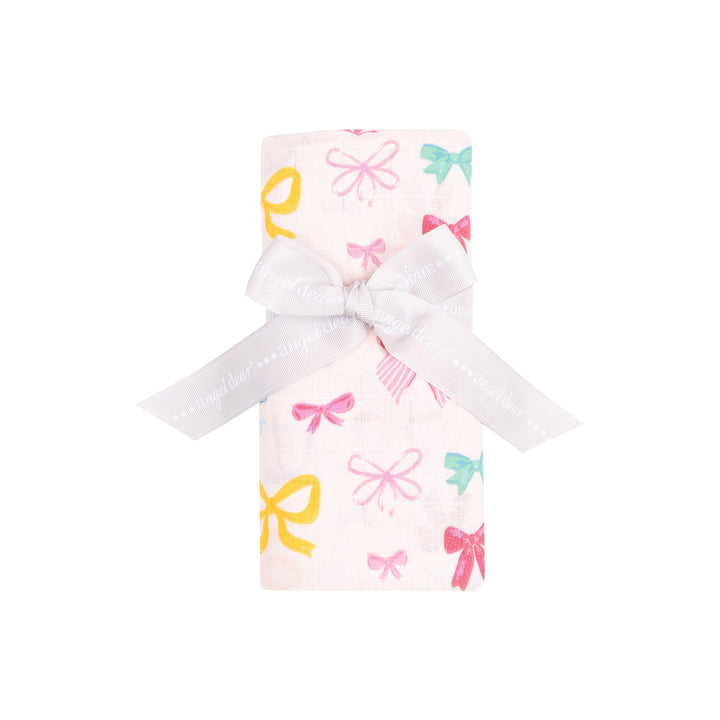 multi colored bow swaddle rolled and tied with a white bow, this is the way the swaddle is sold. 