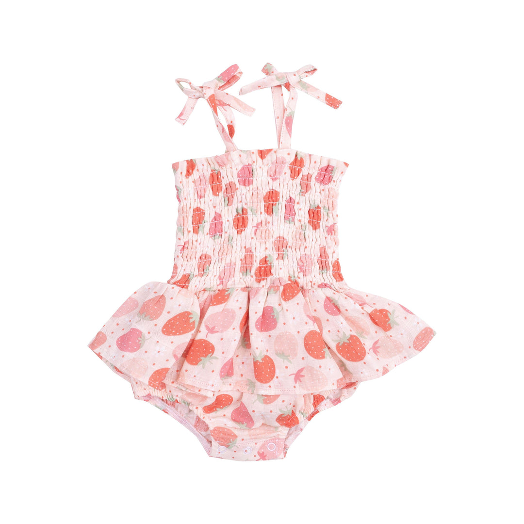 pink smocked bubble with spaghetti straps that tie at the shoulder and peplum skirts. strawberry print all over