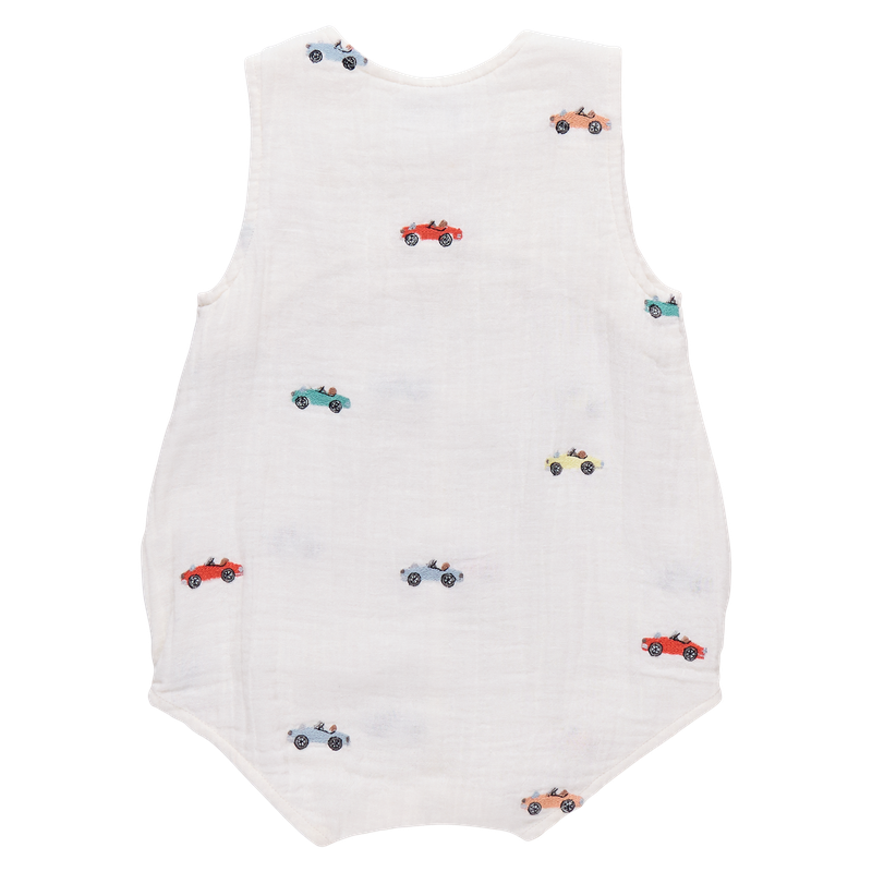 White romper with colorful car patterns on a white background