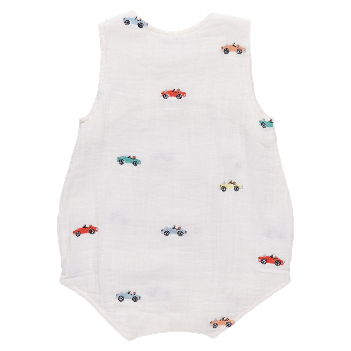 White romper with colorful car patterns on a white background