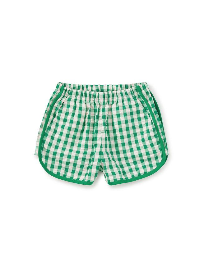 Green and white checkered shorts on a white background