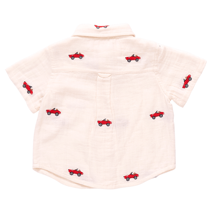 this picture shows the back of the ivory gauze shirt with embroidered cars