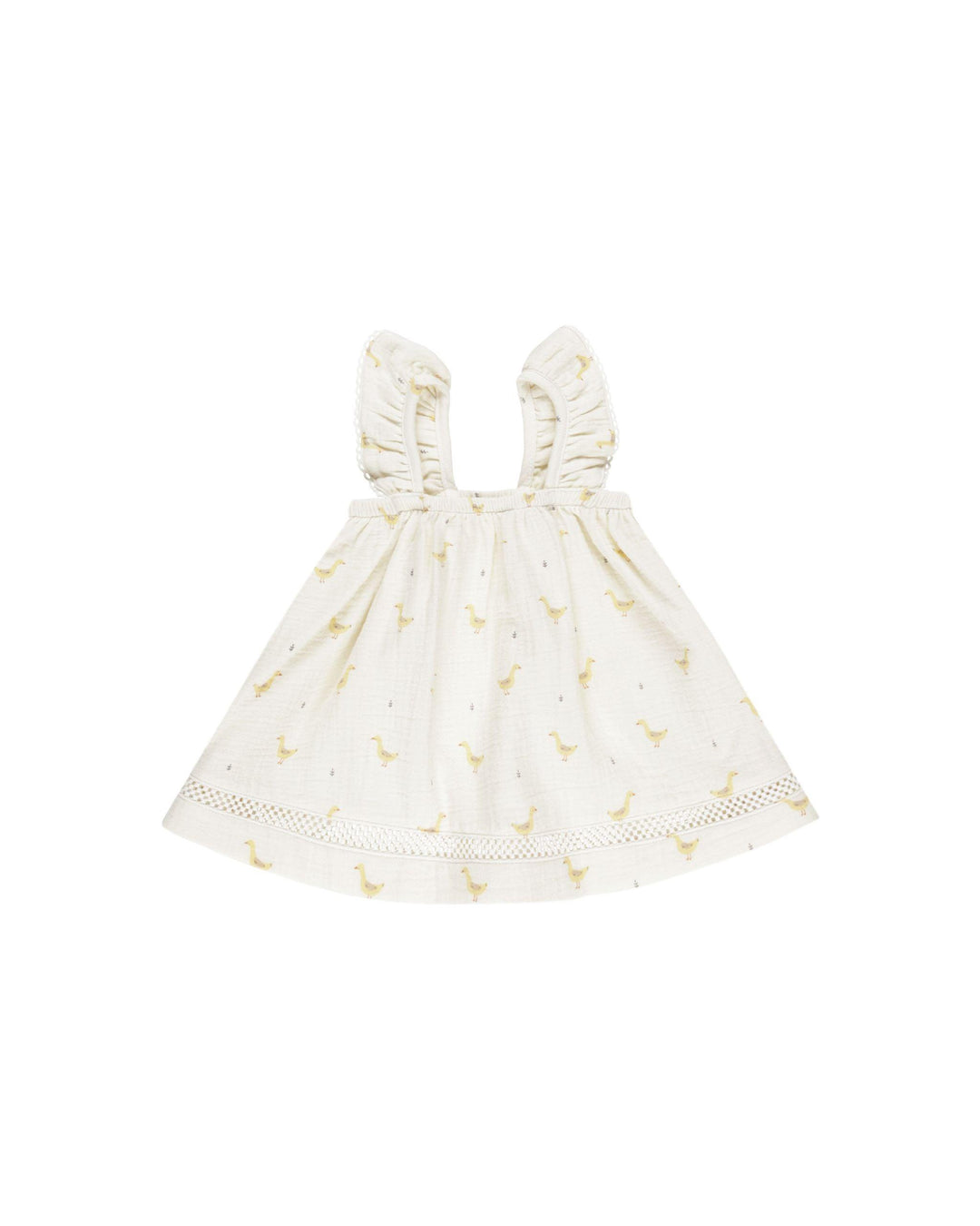 beige dress with yellow geese printed on it. sleeveless ruffles for sleeves. 