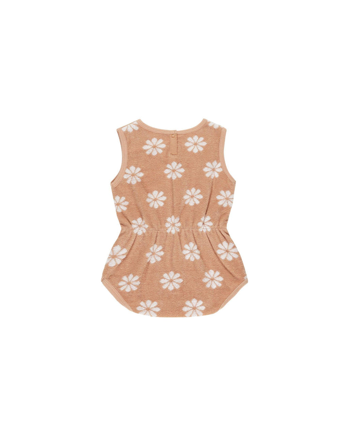 cinch playsuit with snaps at the bottom. grapefruit color with beige daisies all over. this is the back with two snaps at the top. 