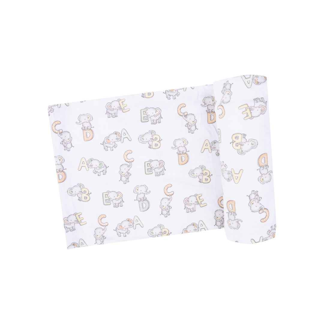 white baby swaddle/receiving blanket with elephants and ABC print all over