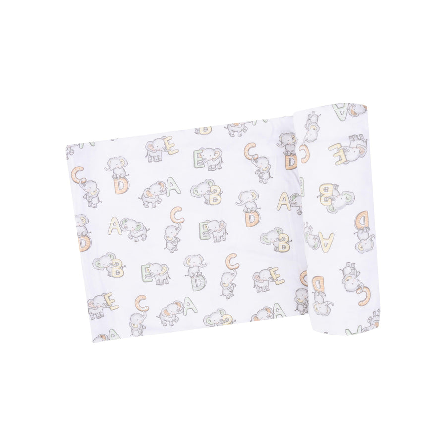 white baby swaddle/receiving blanket with elephants and ABC print all over