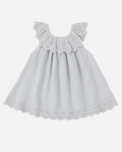 Light blue dress with lace details on a white background