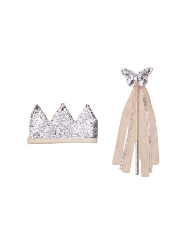 Silver glitter crown and matching wand with tassels on a beige background