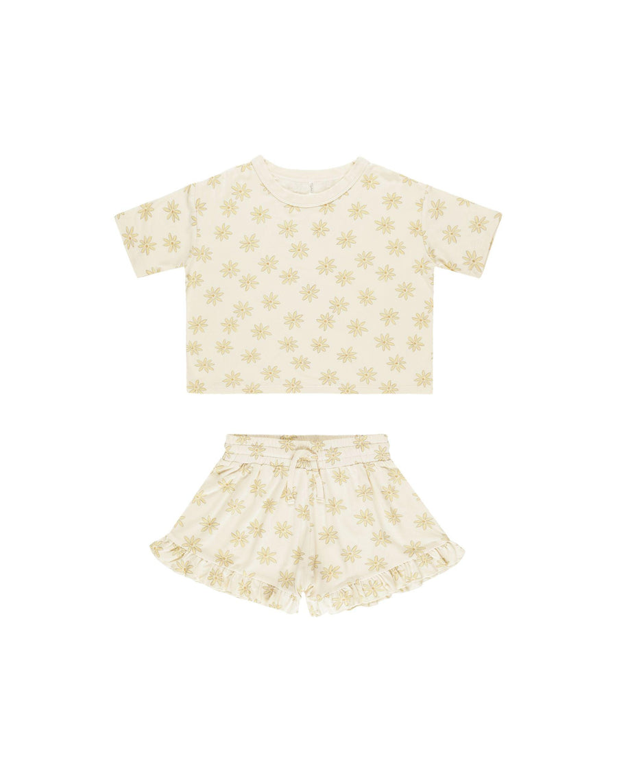 2 piece set for girls top and bottom with daisies on it. shorts have small ruffle on the bottom and drawstring waist 