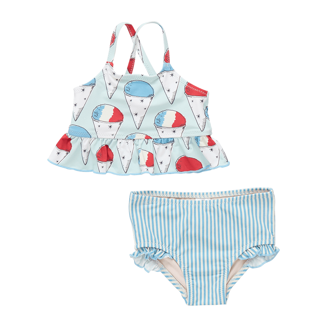 2 piece baby girl bathing suit, top is light blue with snow cones all over it. snow cones have red, white and blue tops. bottoms are blue and white stripe. 