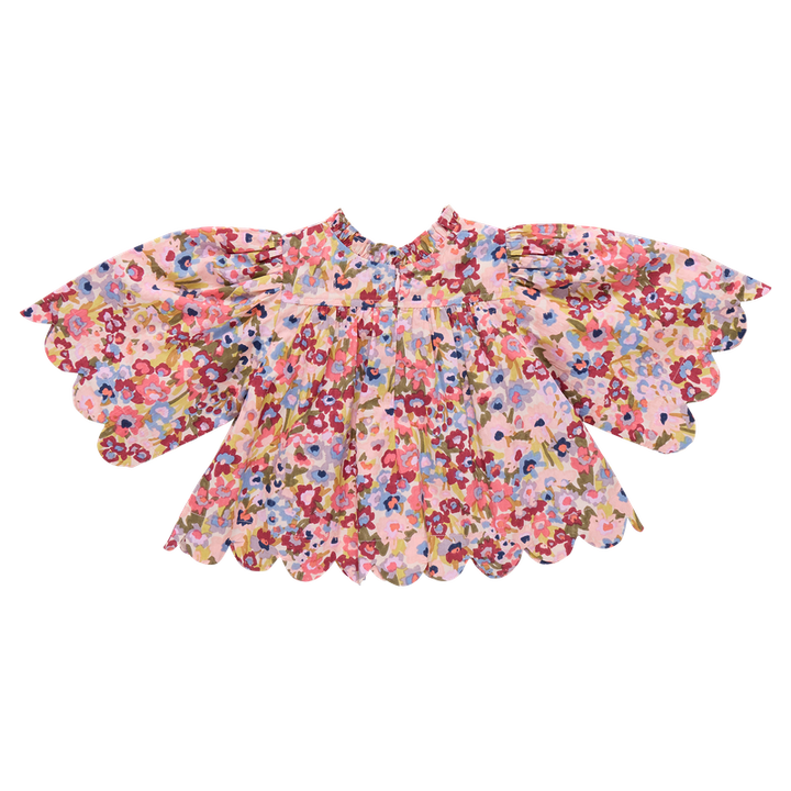 back of Floral blouse with scalloped sleeves on a white background