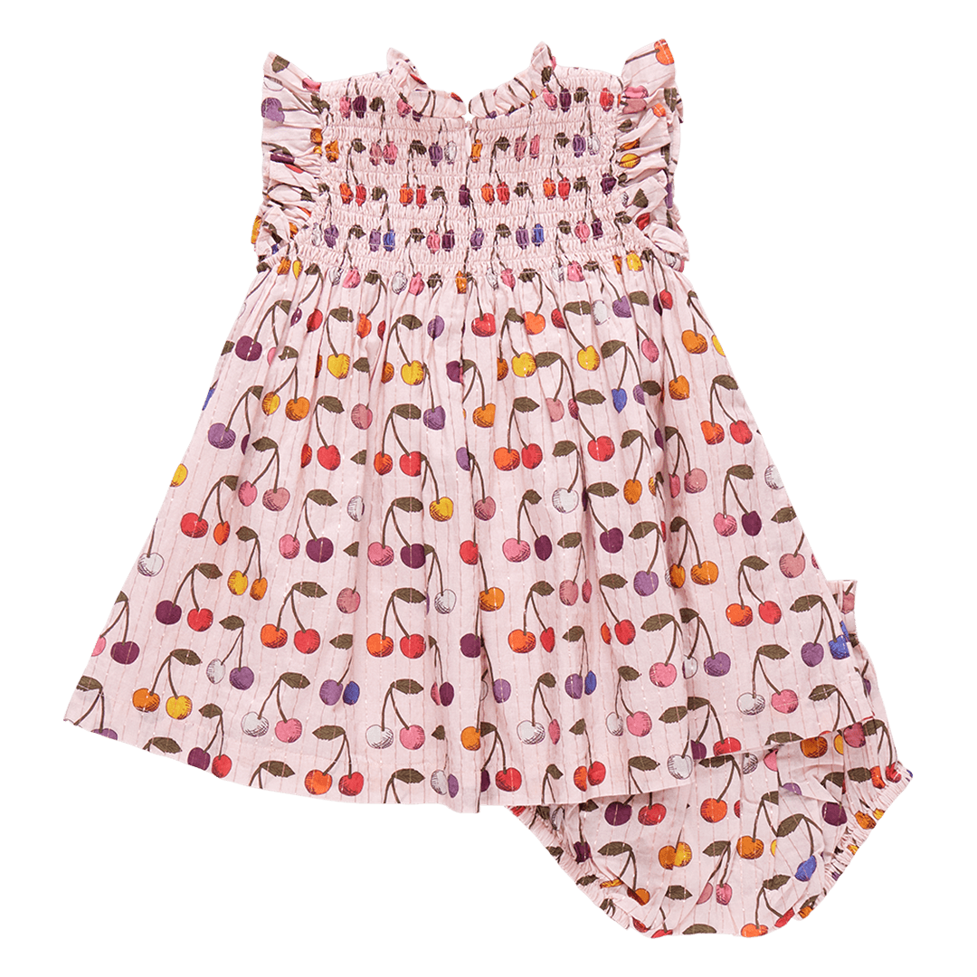 back of pink dress with multi colored cherries all over it. zipper in the back of the dress