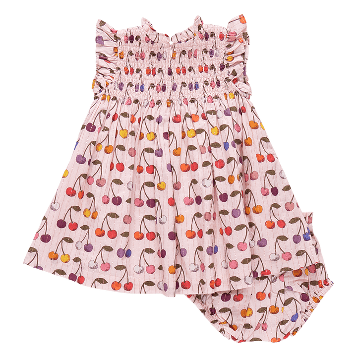 back of pink dress with multi colored cherries all over it. zipper in the back of the dress