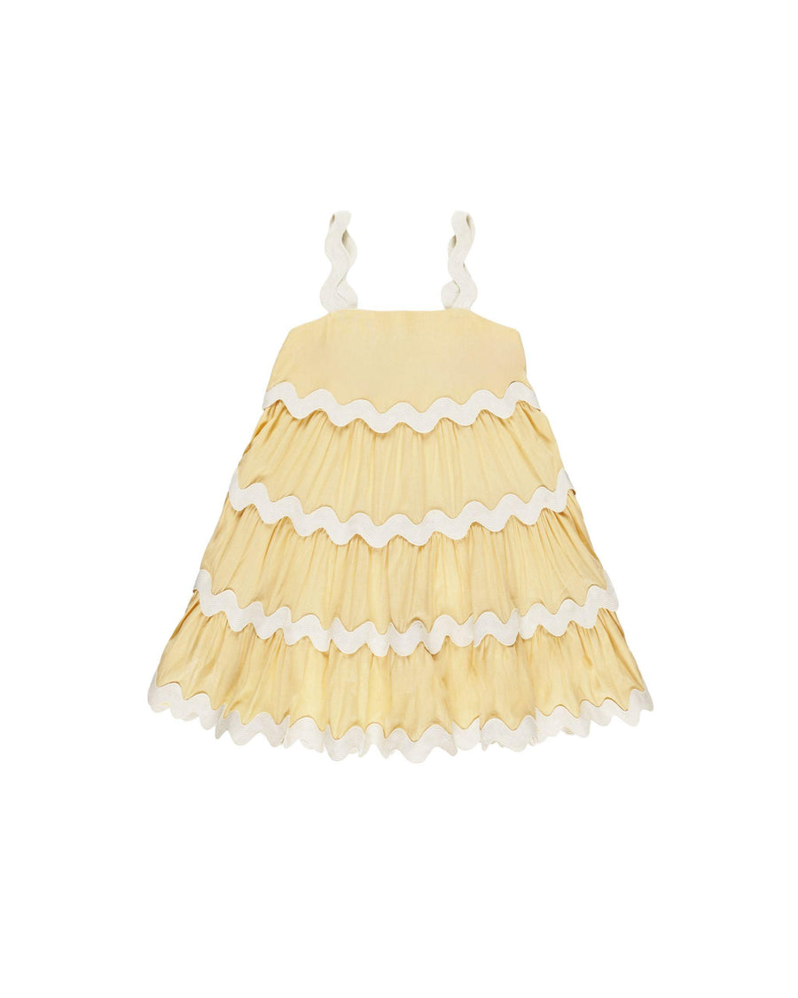 sleevless yellow dress with white ric rac stitching at each ruffle