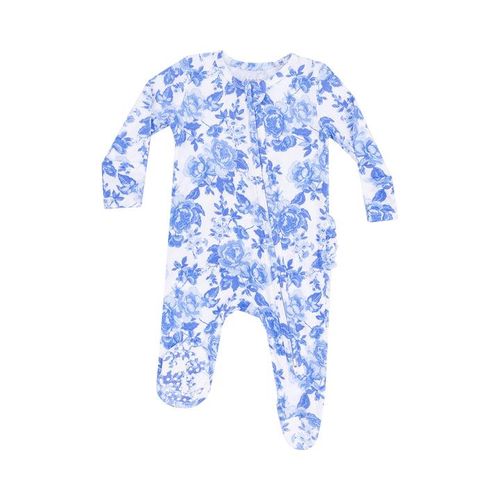 white and blue cabbage roses all over print on a baby footie with ruffles on the bum. 