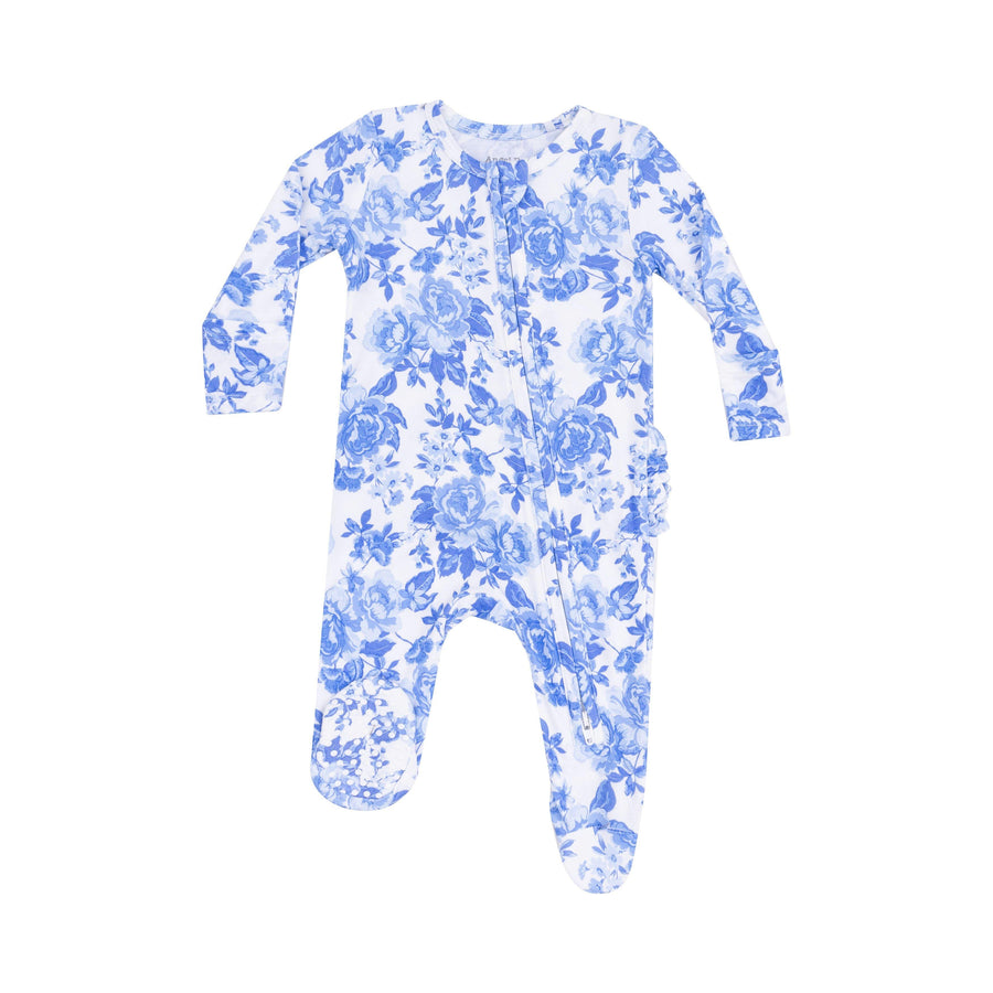 white and blue cabbage roses all over print on a baby footie with ruffles on the bum. 