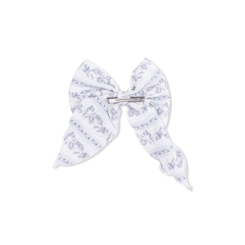 Back of bow with blue floral patterns on a white background