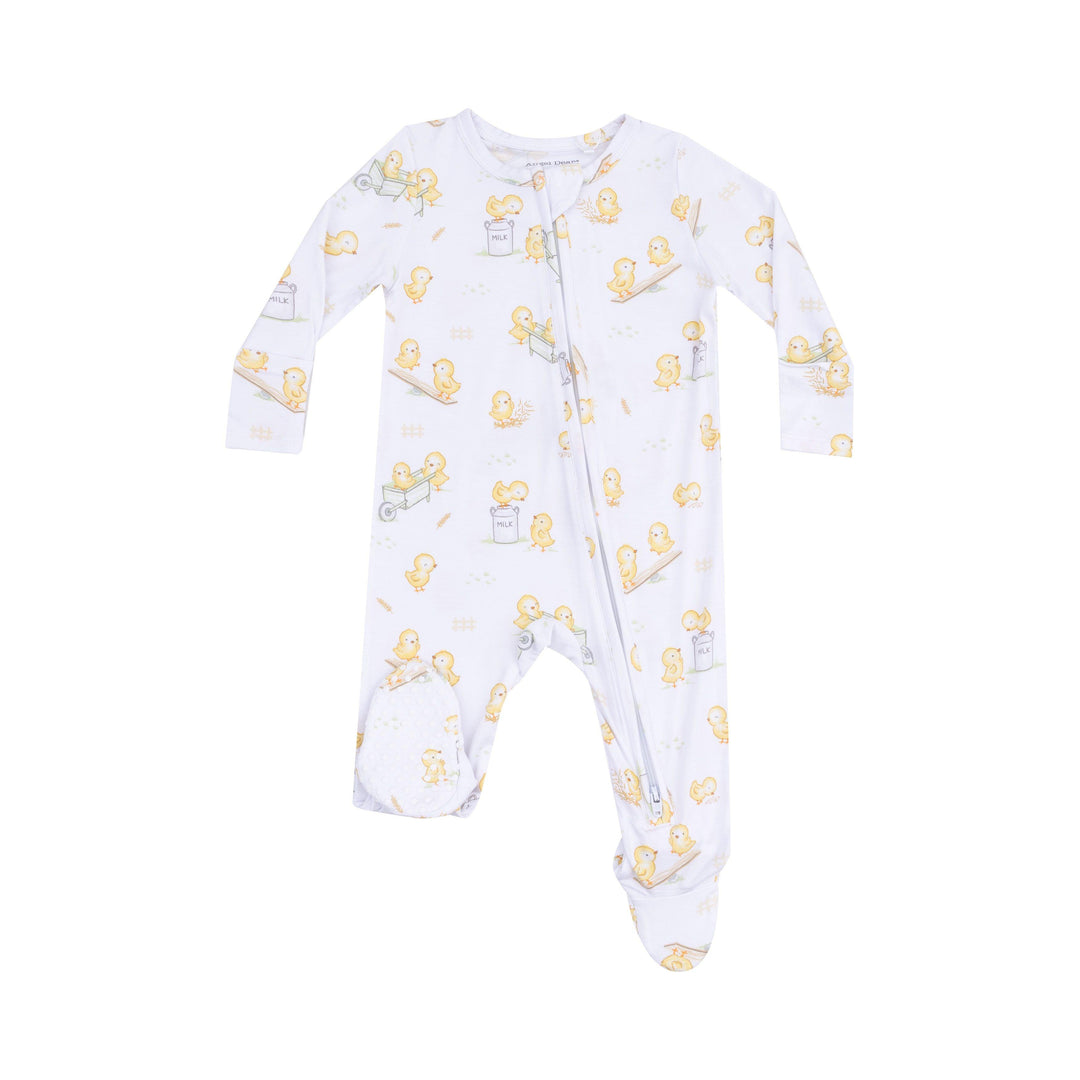 white baby footie with yellow baby chicks all over the are playing in wheel barrels and on see saw.