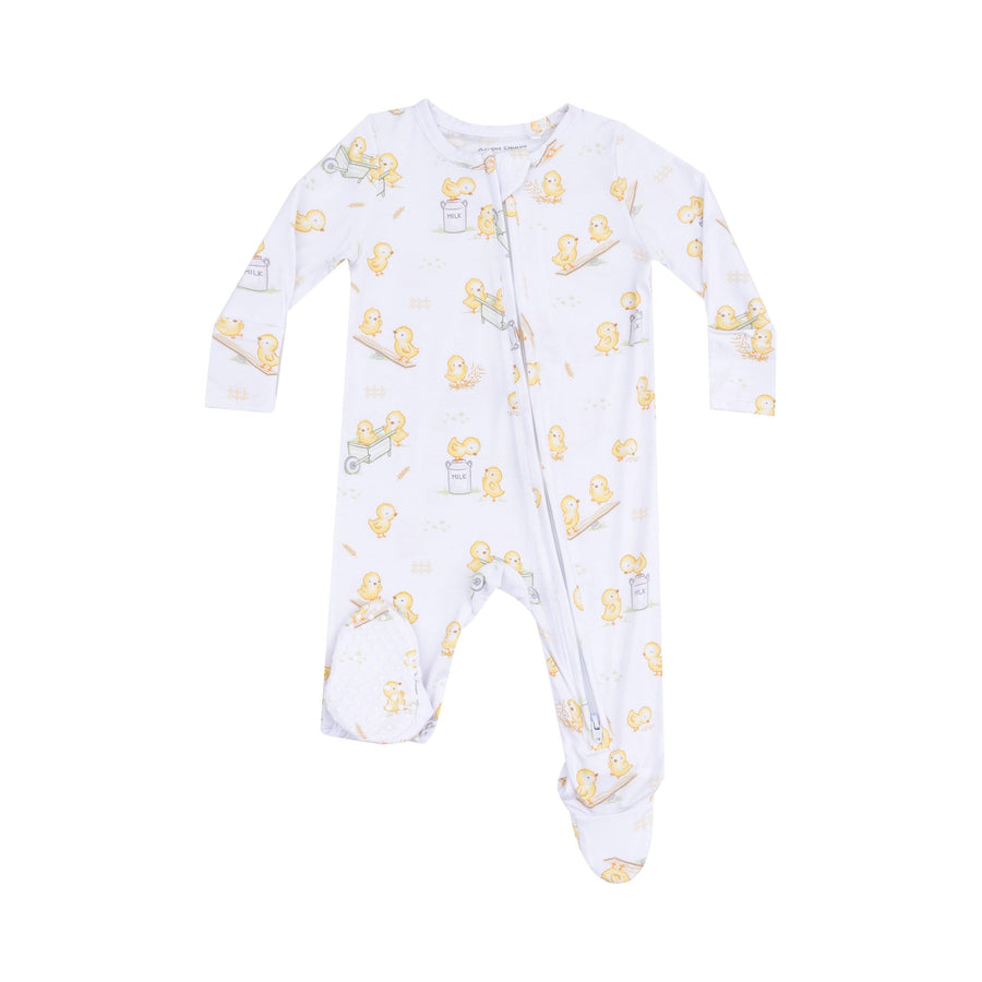 white baby footie with yellow baby chicks all over the are playing in wheel barrels and on see saw.