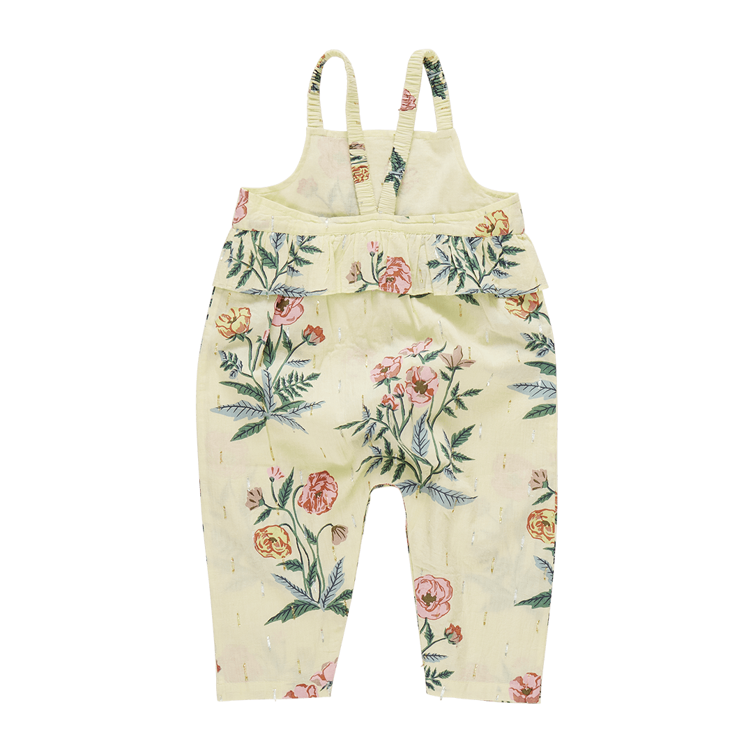 back of pale yellow jumpsuit with spaghetti straps and a peplum at an empire waist 