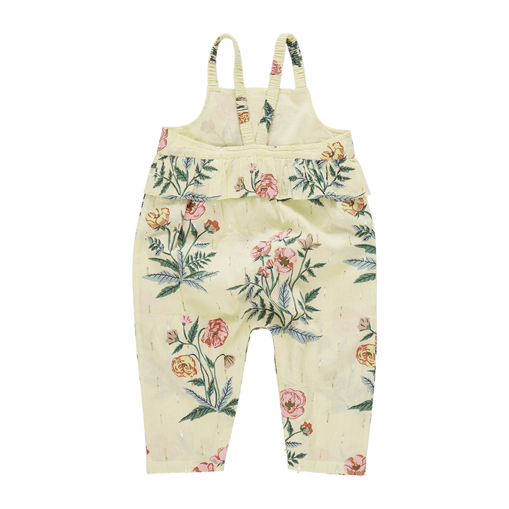 back of pale yellow jumpsuit with spaghetti straps and a peplum at an empire waist 