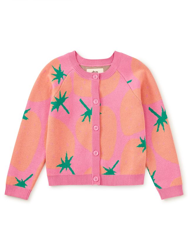 Pink cardigan with strawberry print and green leaf pattern on a white background