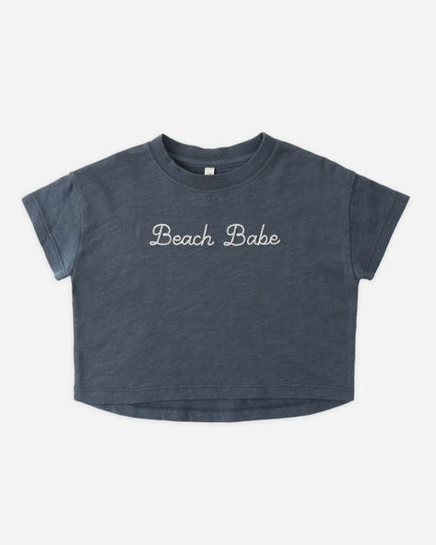 Boxy Tee in navy with the word 'Beach babe' written across it. 
