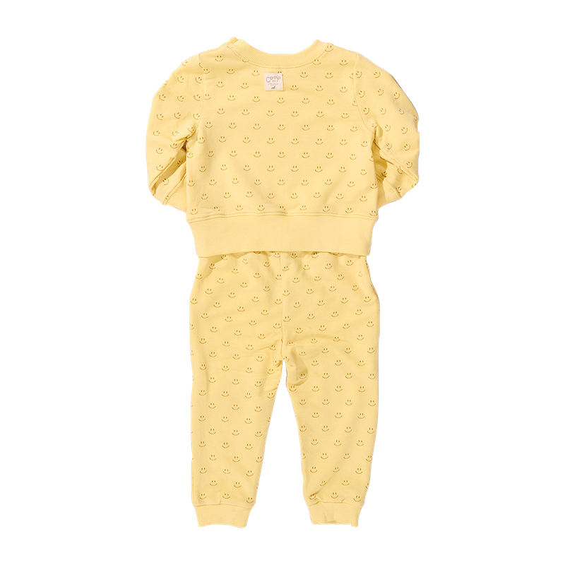 Yellow smiley baby outfit with ruffled sleeves on a white background