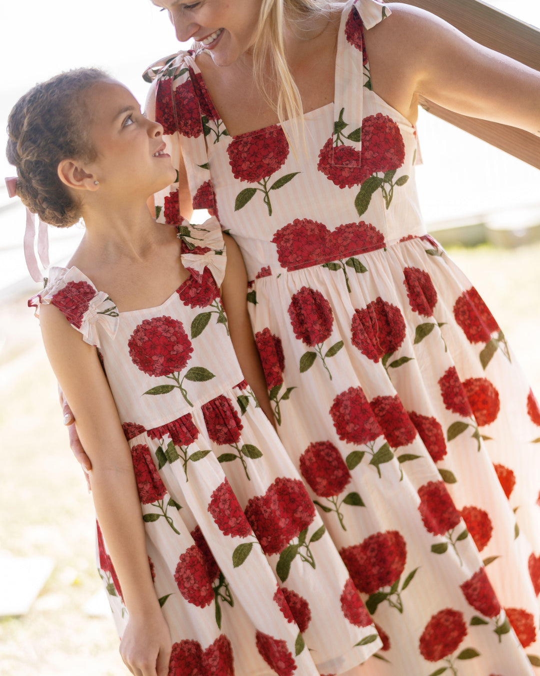 deep pink hydrengeas printed on the dress with a matching mom dress. dress shown in natural light 