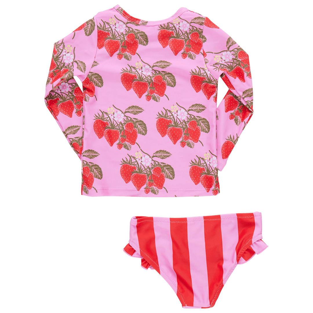 this is a picture of the pack of the rashguard set: long sleeve top pink with red strawberries all over it. the bottoms are a pink and red stripe. 
