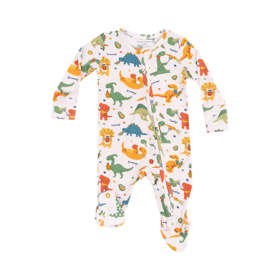 baby footie with dinosaurs all over it eating different veggies. the colors are very vibrant. 