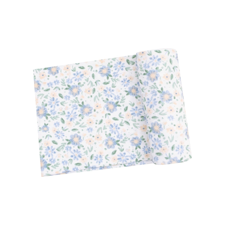 baby swaddle with delicate blue and peach floral print. 
