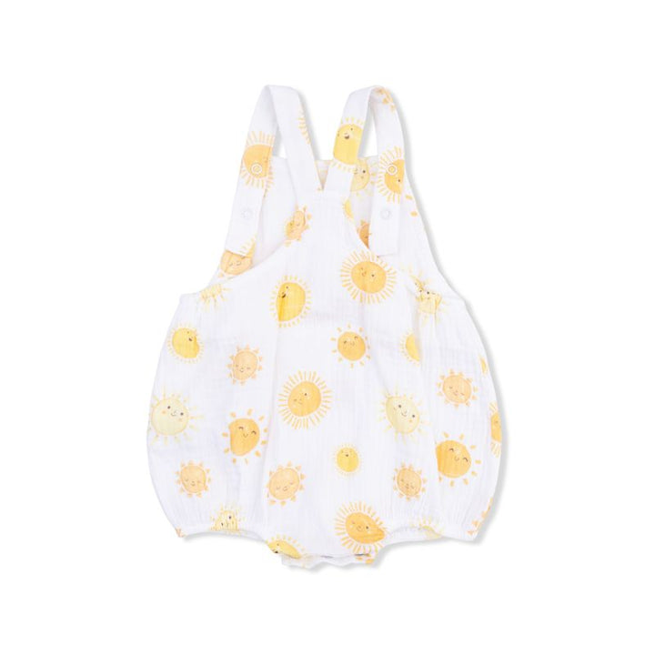 White baby romper with yellow sun patterns on a white background