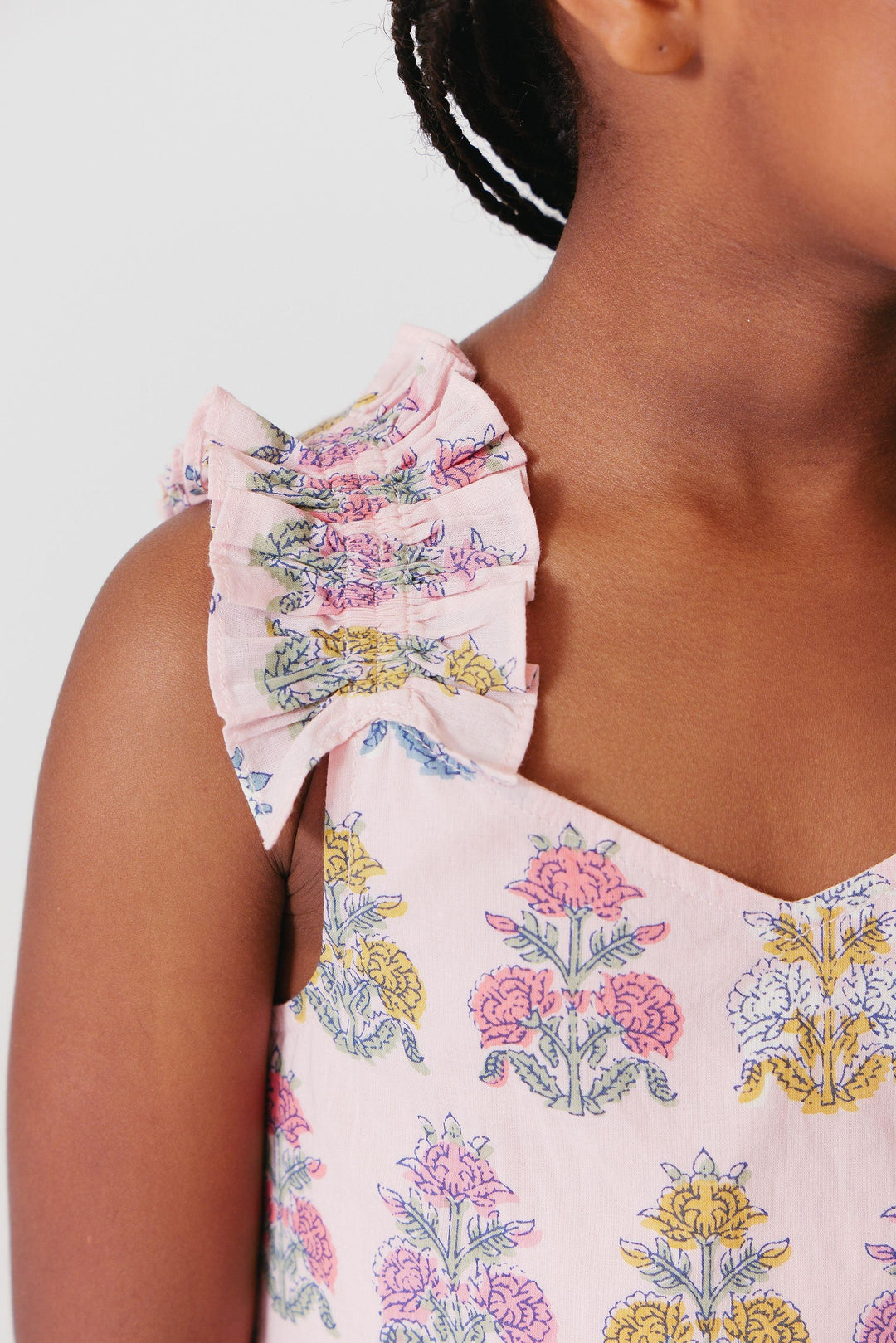 close up of the gathering at the sleeve and the slight v in the neckline of the dress. 