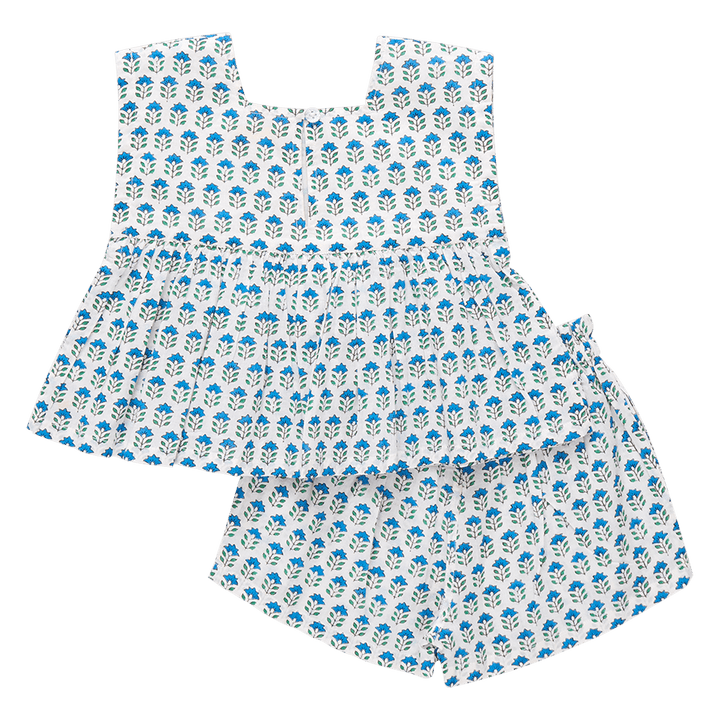 girls set with top and shorts, white with blue flowers and tiny green stems. button closure at the top and elastic waist shorts. 