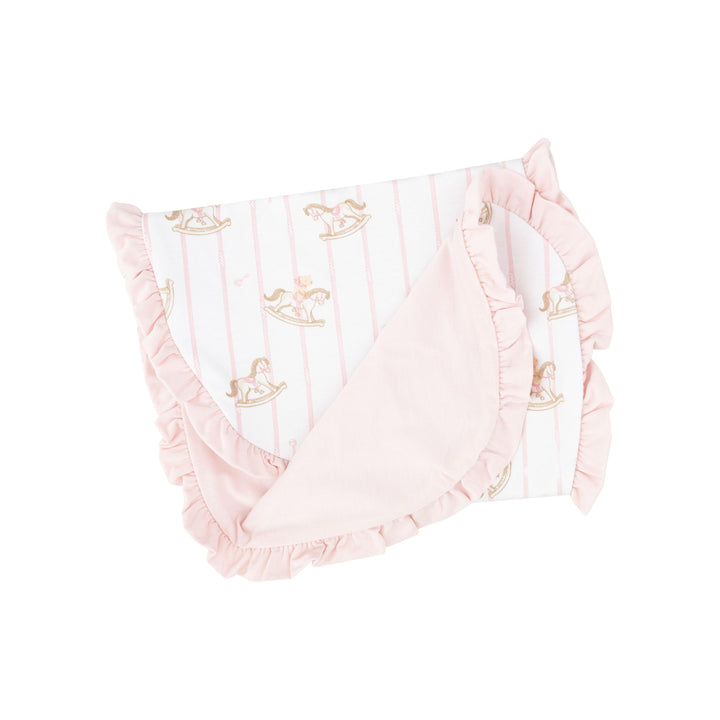 baby girl burp cloth with pink bottom and pink ruffle trim and rocking horses all over the top. 