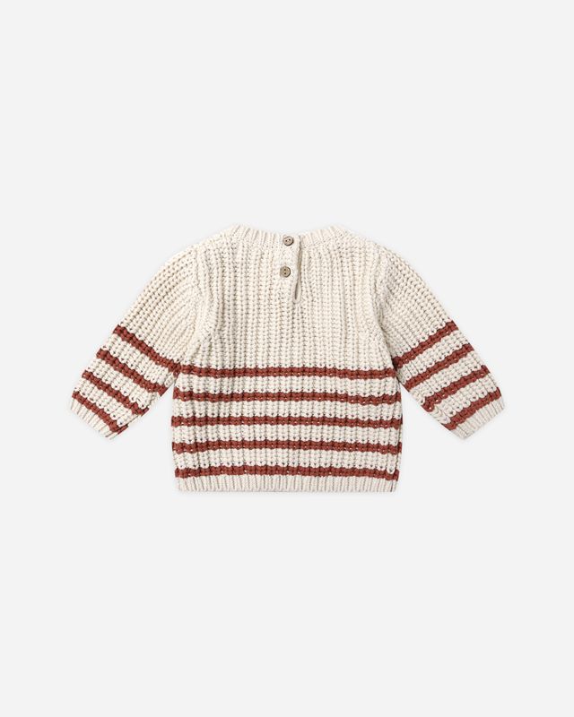 back of Knitted sweater with red and white stripes on a light beige background