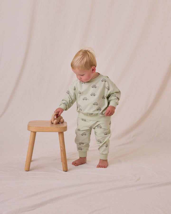 toddler boy modeling the car sweatsuit has a nice relaxed fit. 