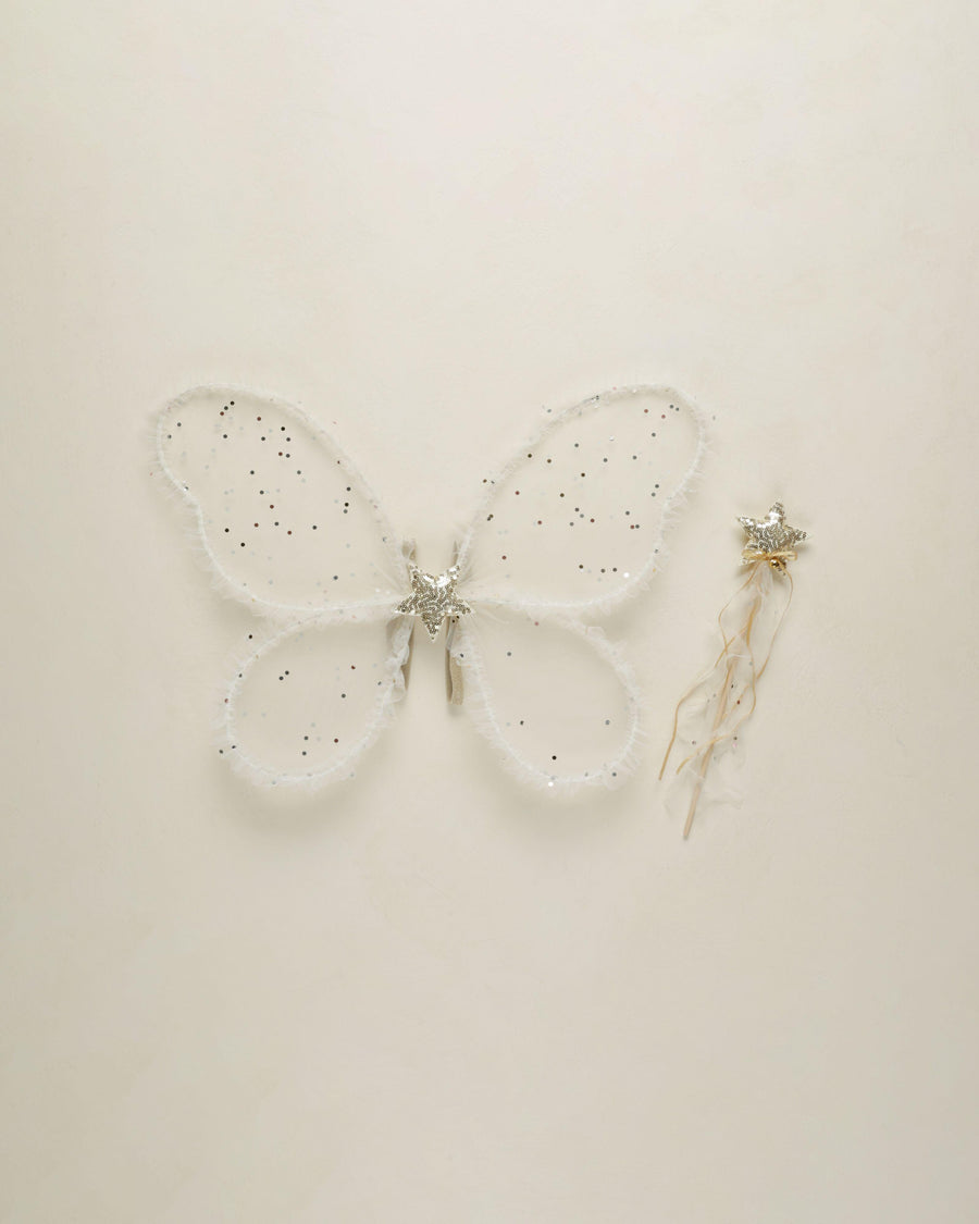 butterfly wings with sheer fabric and a confetti mixed into the wings. a star center in the middle of the wings. 