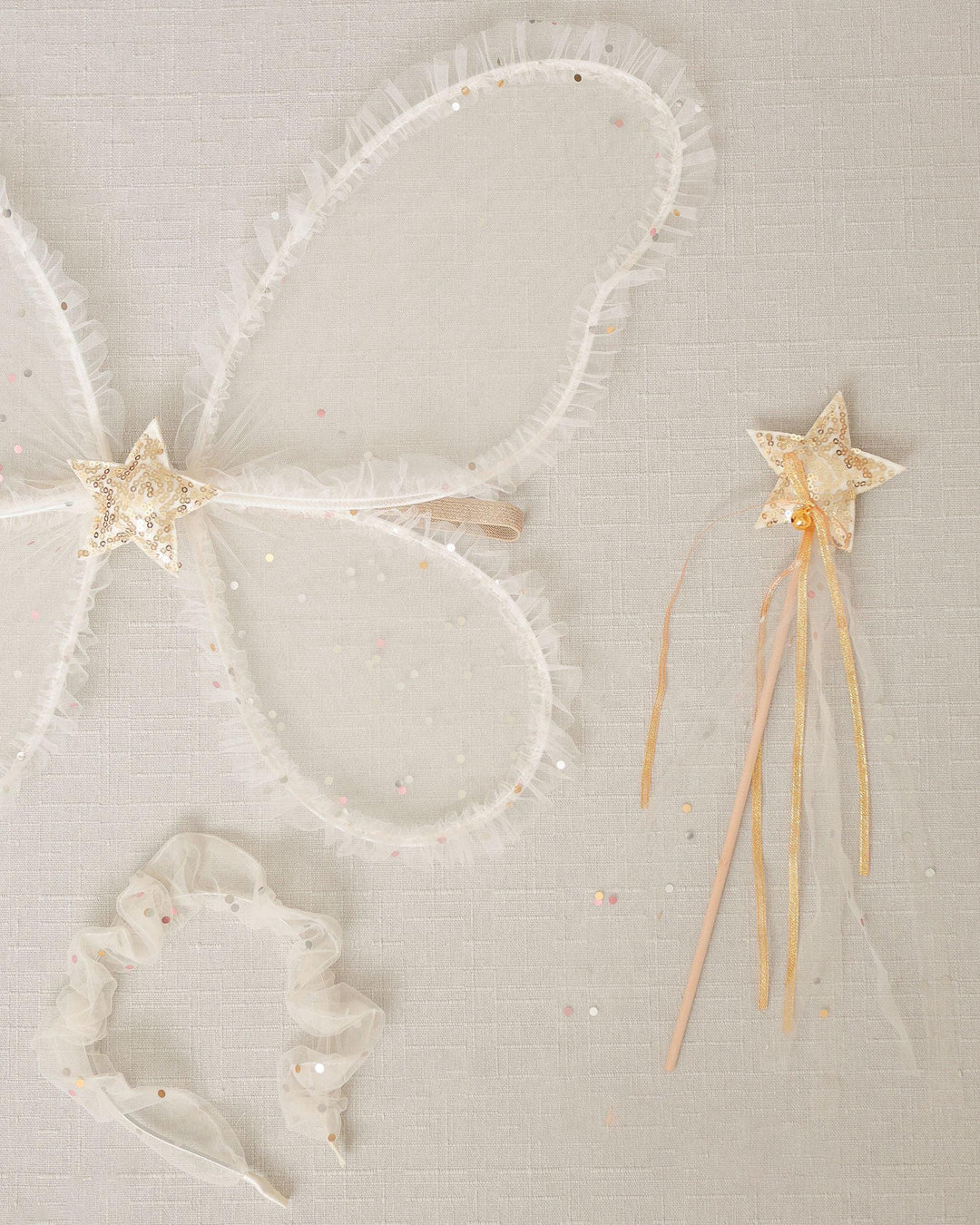 Butterfly wings with a star center and a star wand with beige/gold star on top of the wand. 