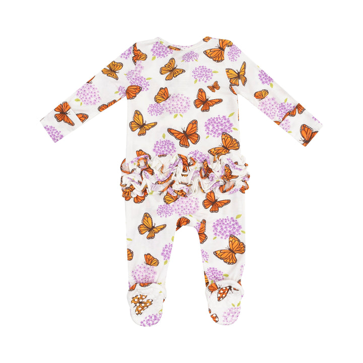 back of baby footie with monarch butterflies and purple milkweed flower print on the footie. ruffles on the bum