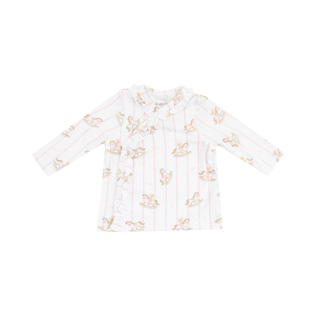 picture of take home top on its own with snap closure and ruffle along the snaps. pink pinstripes and rocking horses pattern. 