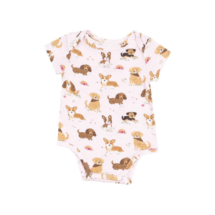 pink baby bodysuit with puppies all over it. snaps at the bottom. 