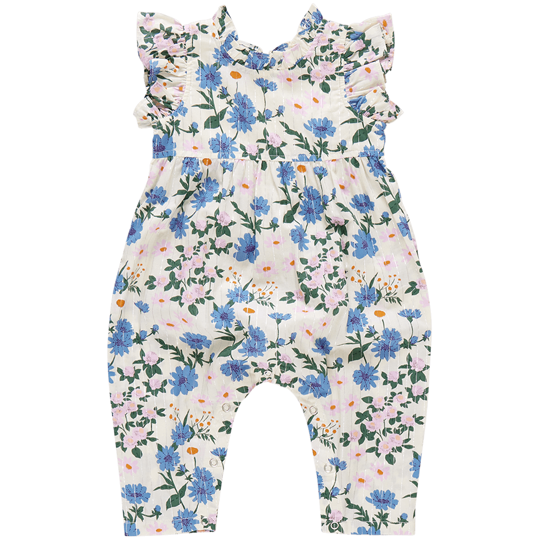 sleeveless jumpsuit with ruffles at the arms and high neck. white with blue and lavender flowers. 