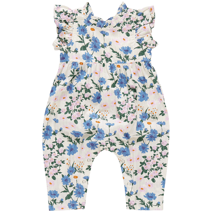 sleeveless jumpsuit with ruffles at the arms and high neck. white with blue and lavender flowers. 