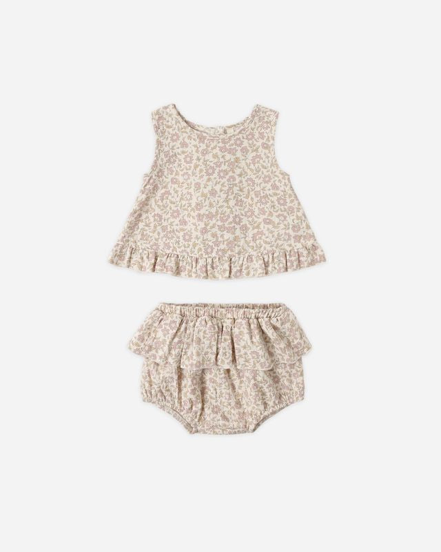 Floral baby outfit with top and bloomers on a white background