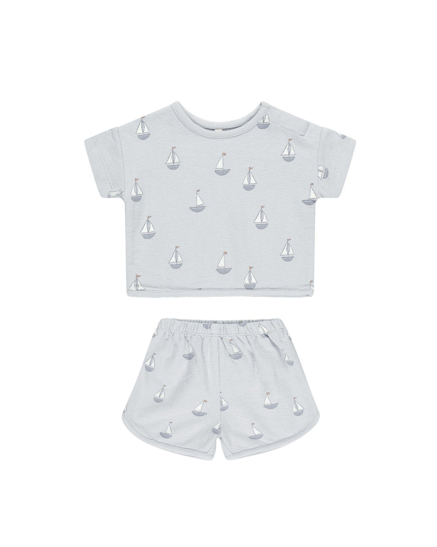light blue/gray 2 piece cotton set with small blue and white sail boats all over. short sleeve tops and shorts. 